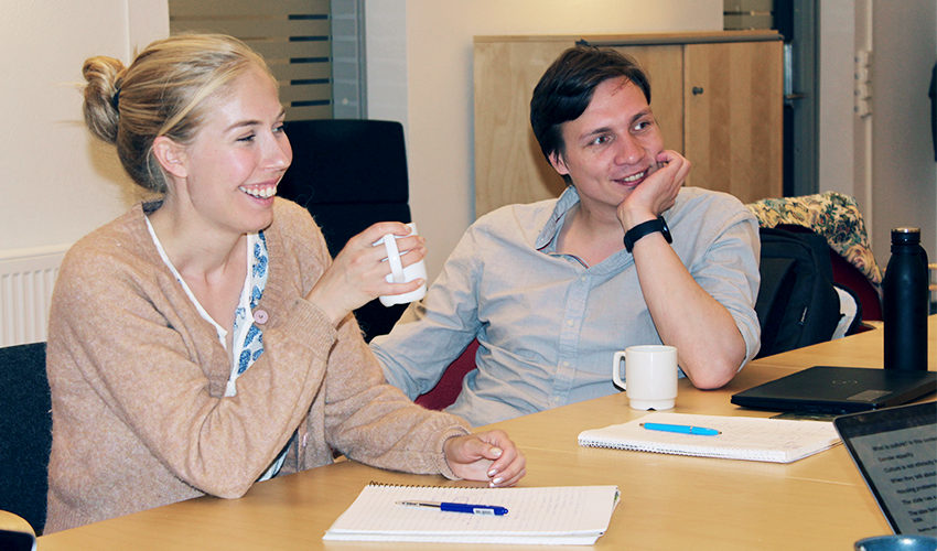 Two students in a classroom. Photo.