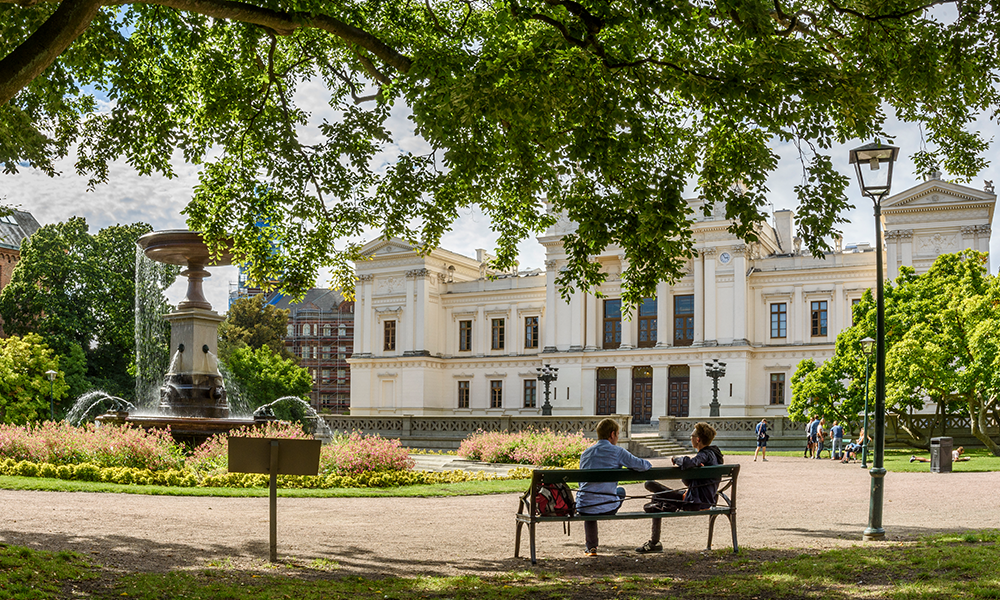Large white building in a park. Photo.