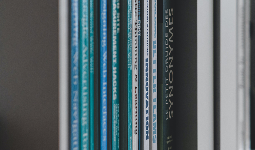 Backs of a row of books. Photo.